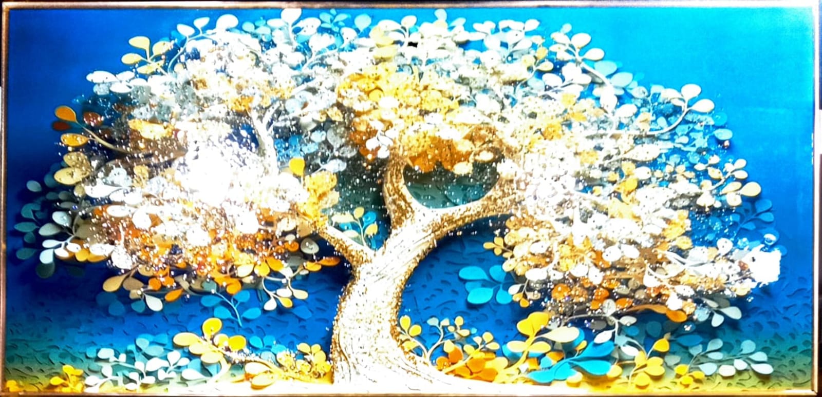 Vibrant wall art featuring a golden tree against a blue background